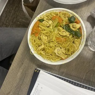 a bowl of noodles on a table