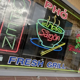 a neon sign in the window