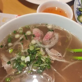 Flank steak pho with crispy egg rolls