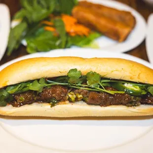 Bánh Mì Thịt Nướng (Grilled Pork Bánh Mì): Filled with smoky, marinated grilled pork.