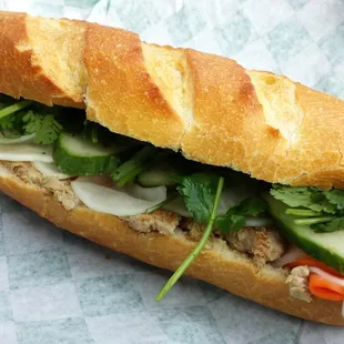 pork chop sandwich with pate spread, sweet carrots/white radish, cucumber, fresh cilantro
