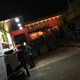 a food truck parked in front of a restaurant