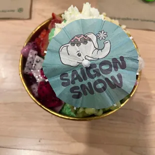 Small pandan snow with dragon fruit, strawberries, banh tam khoai mi, banh da lon, rice crispies, topped with whipped cream