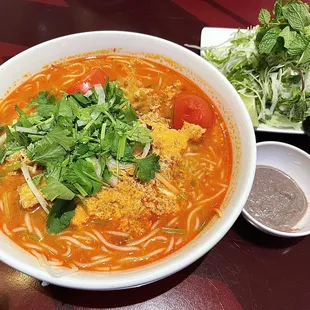 Bun rieu with extra side of mam. Wish they didn&apos;t sprinkle veggies on before serving. Dish itself was delicious though.