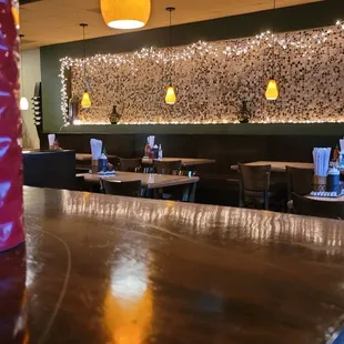 the bar and dining area of a restaurant