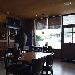 a view of a restaurant with tables and chairs