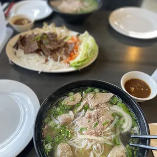 Pho (meatball and brisket), bbq pork spring roll plate, and Rare Steak &amp; Flank Pho