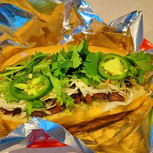 a sub sandwich wrapped in foil