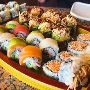 a tray of sushi on a table