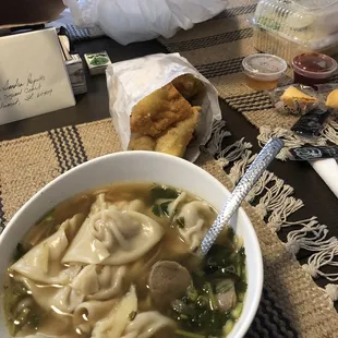 Wonton egg noodle soup. I didn't put the noodles/bean sprouts in yet. Appetizer combo in the small bag.