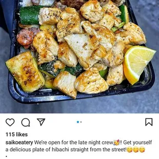 a person holding a tray of food