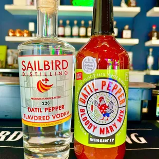 a bottle of distilled pepper next to a bottle of distilled pepper