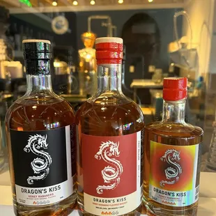 three bottles of alcohol