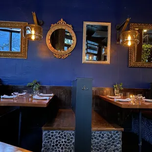 the interior of a restaurant with blue walls