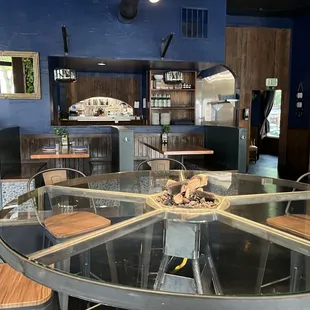 a restaurant with a circular glass table