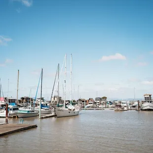 Sunny day, sailboats and houseboats at Sailing Goat at Point San Pablo Harbor in Richmond California.