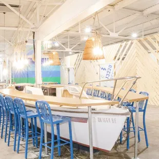 The bar is made from a sailboat that's lived its full life navigating earth's waters.