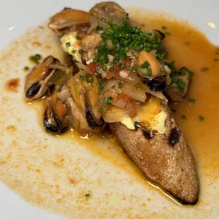 a plate of food with mushrooms and cheese