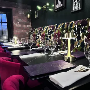 a dining room with purple chairs