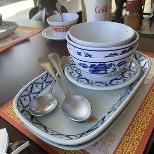 Empty bowls of Green Curry &amp; Panang Curry