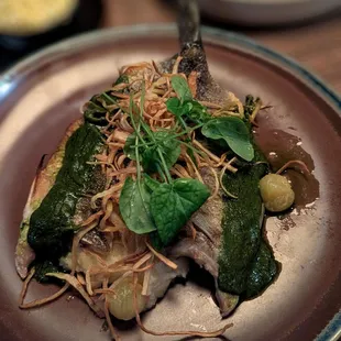 Pretty much the whole branzino on a parsnip mash topped with  crispy parsnips and chimichurri.