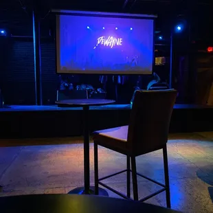 a stage with a large screen