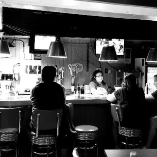 people sitting at the bar