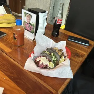 a person sitting at a table with a plate of food