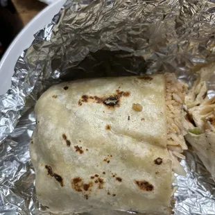 Half of a chicken burrito