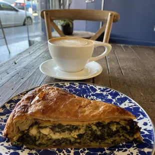 a plate of food and a cup of coffee