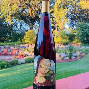 a bottle of wine on a deck