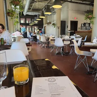 people sitting at tables in a restaurant