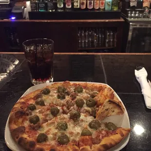 Sausage and green olive pizza