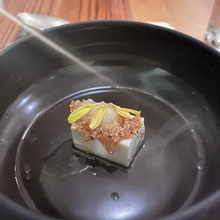 a dessert in a black bowl