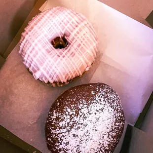 Strawberry-iced and raspberry-filled doughnuts. (Not pictured: the vanilla-iced one we ate on the way home)