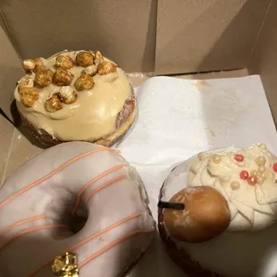three doughnuts in a box