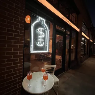 a table and chairs outside of a restaurant