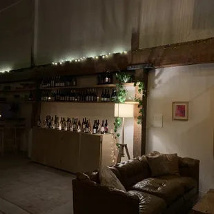 a living room with a couch and a bar