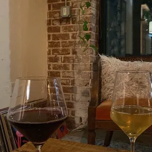 two glasses of wine on a table