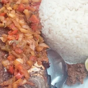 a plate of food with rice and meat