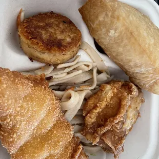 Fish, chow fun, fried chicken, corn beef hash and cone sushi