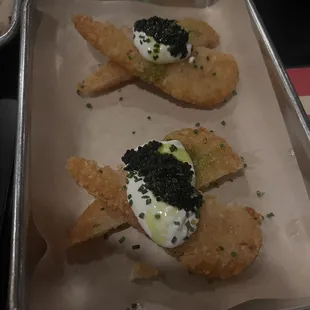 Hash browns with sour cream and caviar.