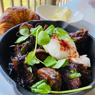 a plate of food with meat and vegetables