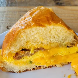 Breakfast Sandwich - Egg, Cheddar, Sausage, Sauce on Toasted Brioche Bun - Deeeelicioussss!