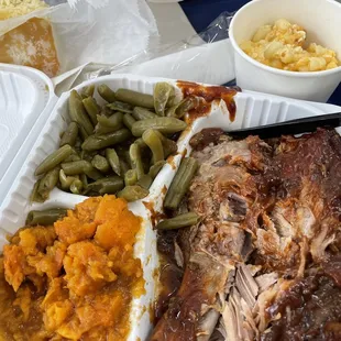 Rib dinner with sweet potatoes and green beans.