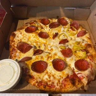 Mushroom with pepperoni and banana peppers on half