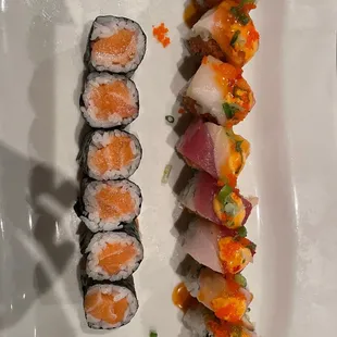 a plate of sushi and a roll