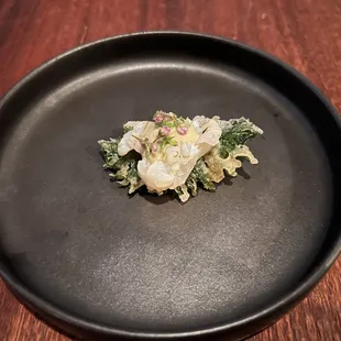 a plate of food on a wooden table