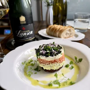 Caviar Parfait a la Mina, hash brown, horseradish créme fraîché smoked salmon, farm egg