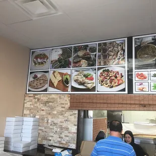 a man sitting at a counter in a restaurant
